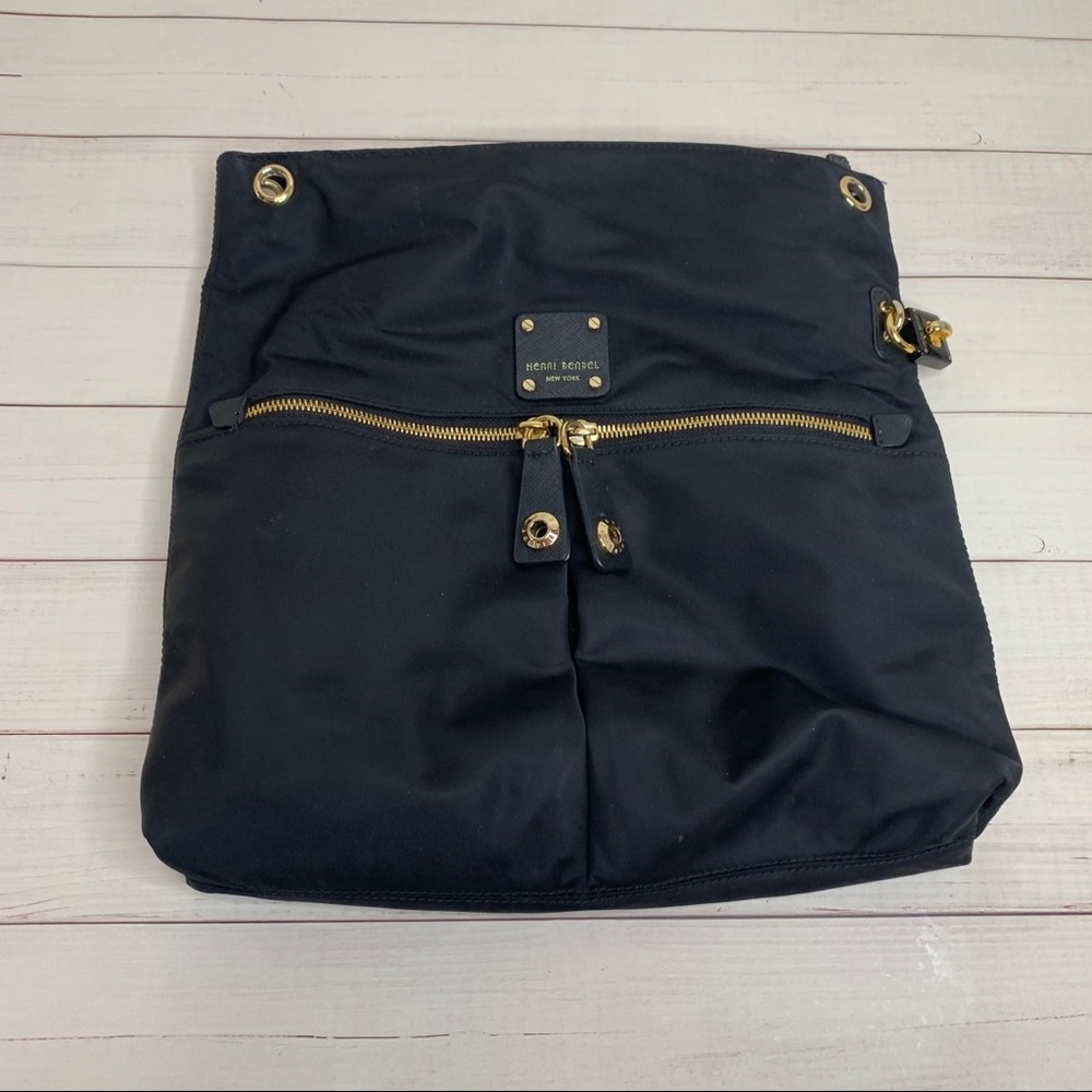 Black Henri Bendel bag with bold purple interior... no strap